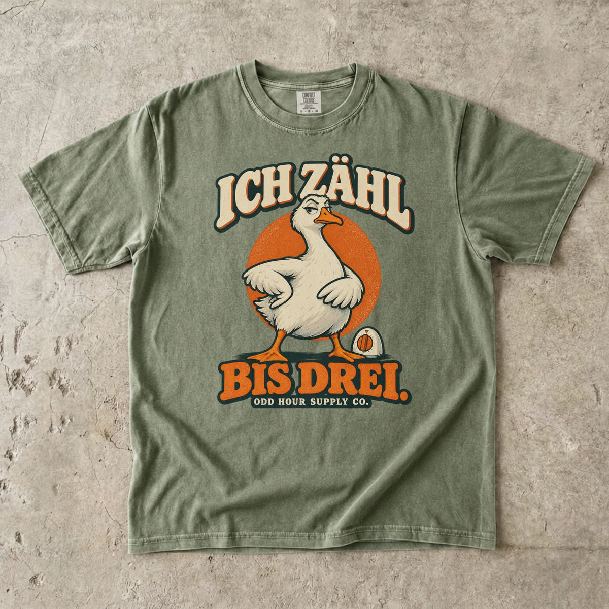 Comfort Colors 1717 T-Shirt in Hemp mit dem Motiv „Ich zähl bis drei“ mit Gans, Vorderansicht