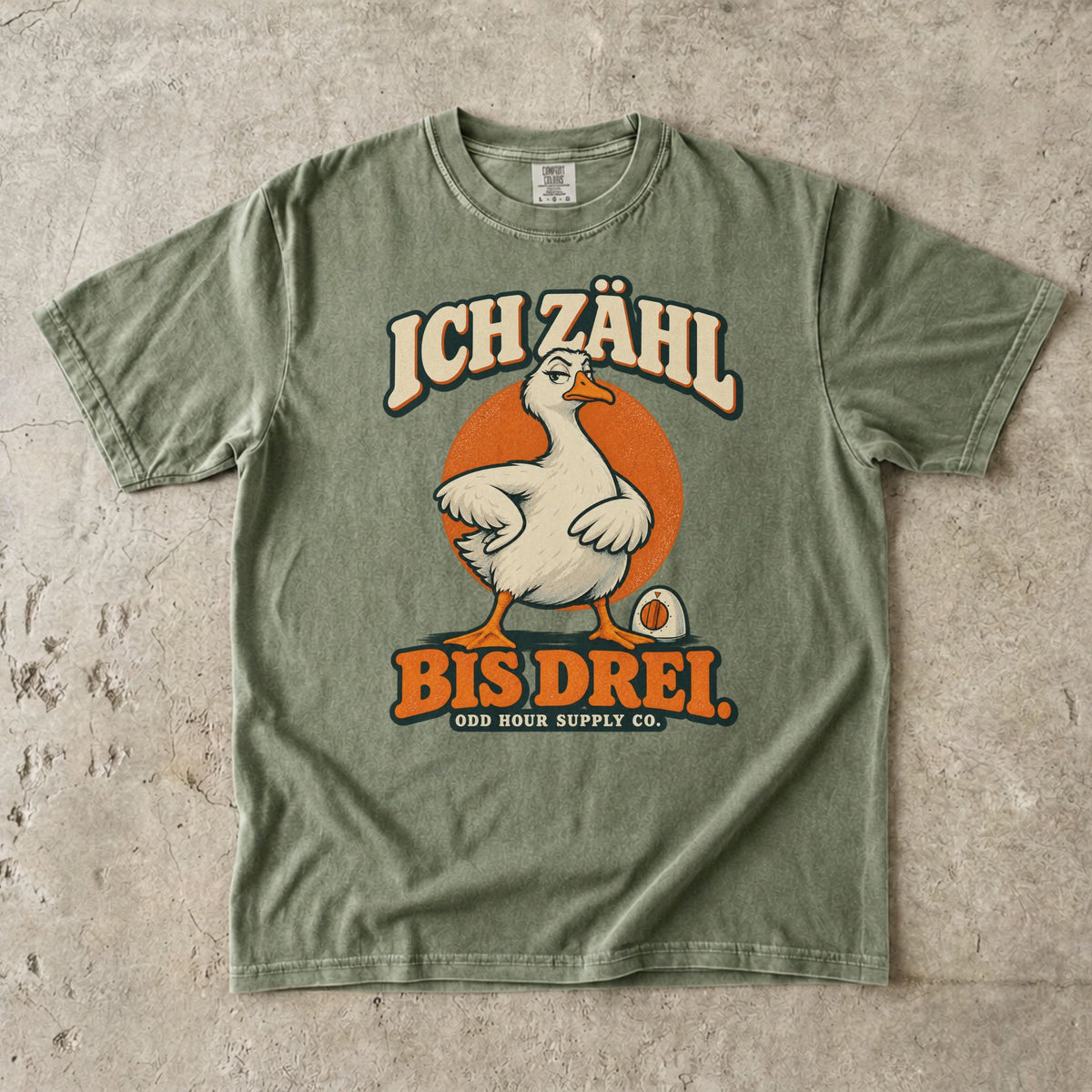 Comfort Colors 1717 T-Shirt in Hemp mit dem Motiv „Ich zähl bis drei“ mit Gans, Vorderansicht