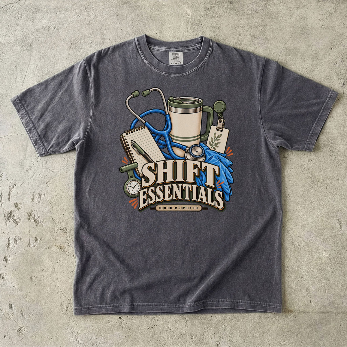 Shift Essentials Pflegeausrüstung-Motiv auf einem Comfort Colors 1717 T-Shirt in Pepper