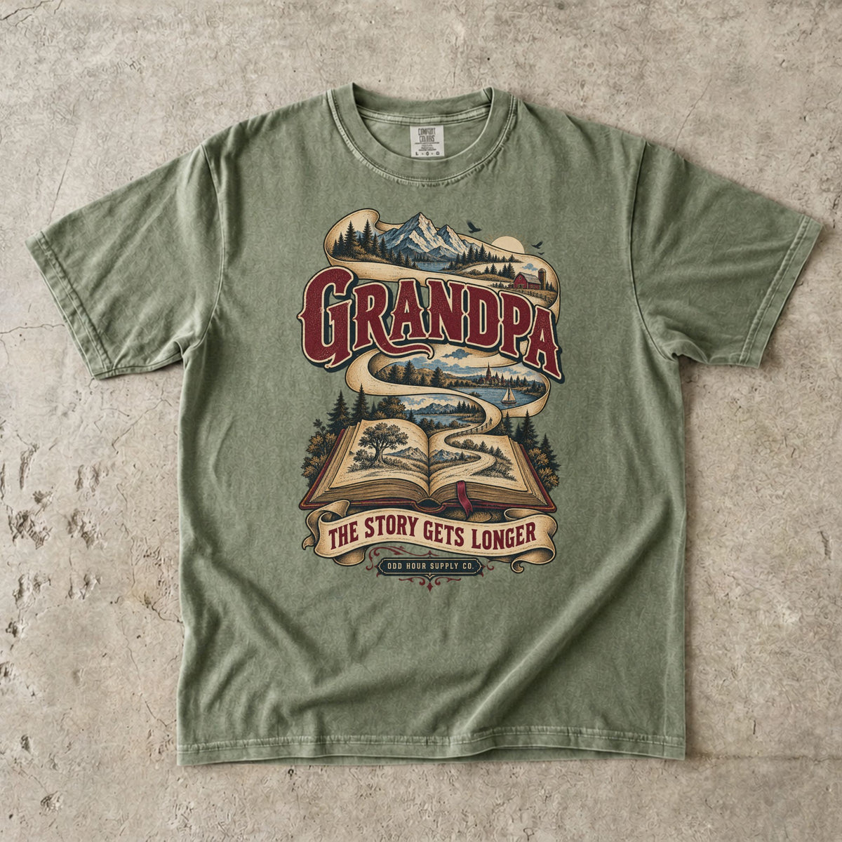 Hemp-T-Shirt mit GRANDPA THE STORY GETS LONGER, offenem Buch und Landschaftsband von Odd Hour Supply Co.